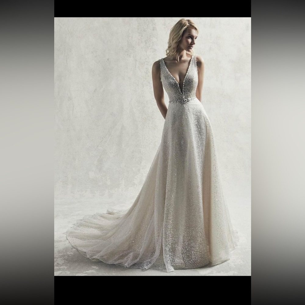 Brand new still with tags. Jarret by Sottero Midgley. Size 12. Never altered.